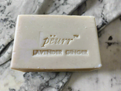 Bar of soap with 'peurr' branding on a marble background