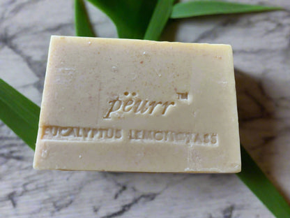 Bar of soap with 'peurr' branding on a marble surface