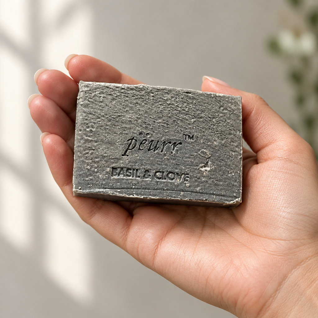 Basil & Clove soap in a woman’s hand
