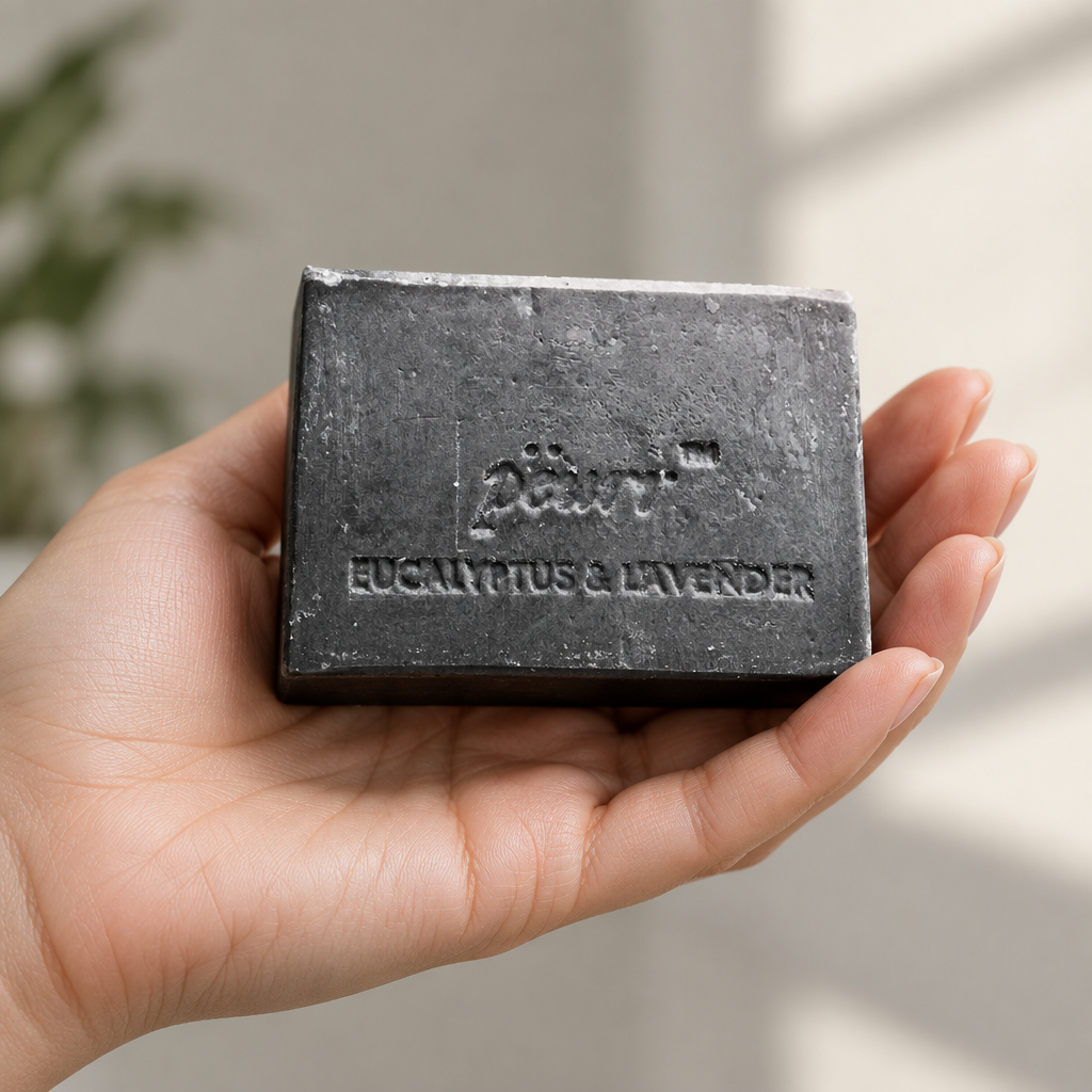 Charcoal Eucalyptus & Lavender soap in a woman’s hand