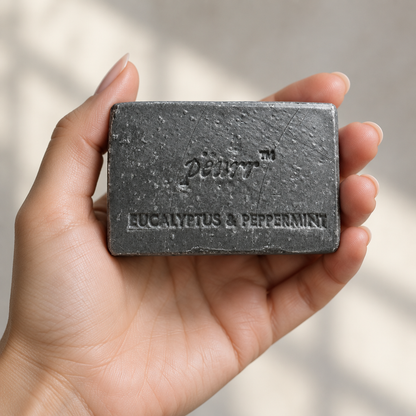 Charcoal Eucalyptus & Peppermint soap in a woman’s hand