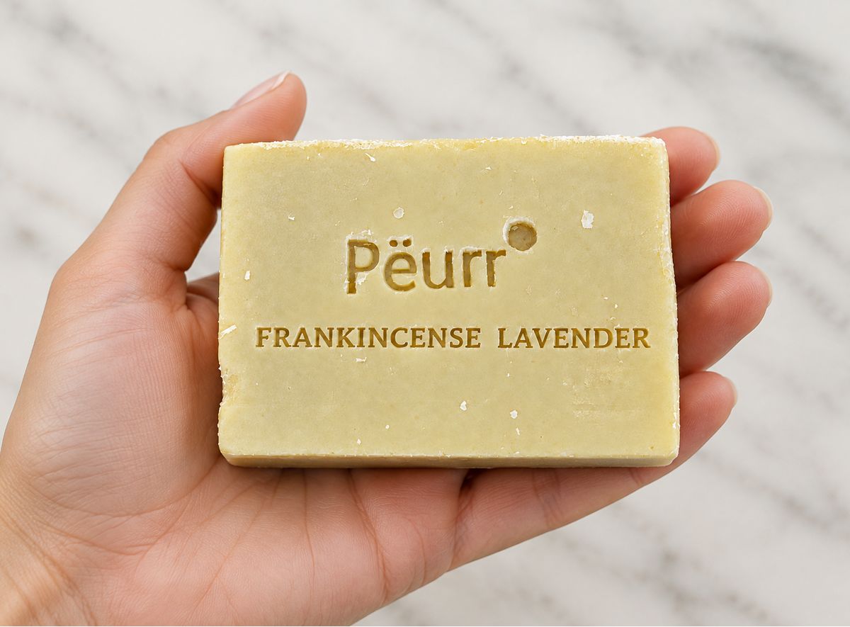 Frankincense Lavender soap resting in a woman’s hand