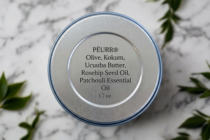 Patchouli Body Butter ingredient label on marble with botanical accents