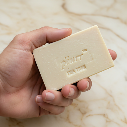 Tea Tree soap held in a man’s hand with no jewelry
